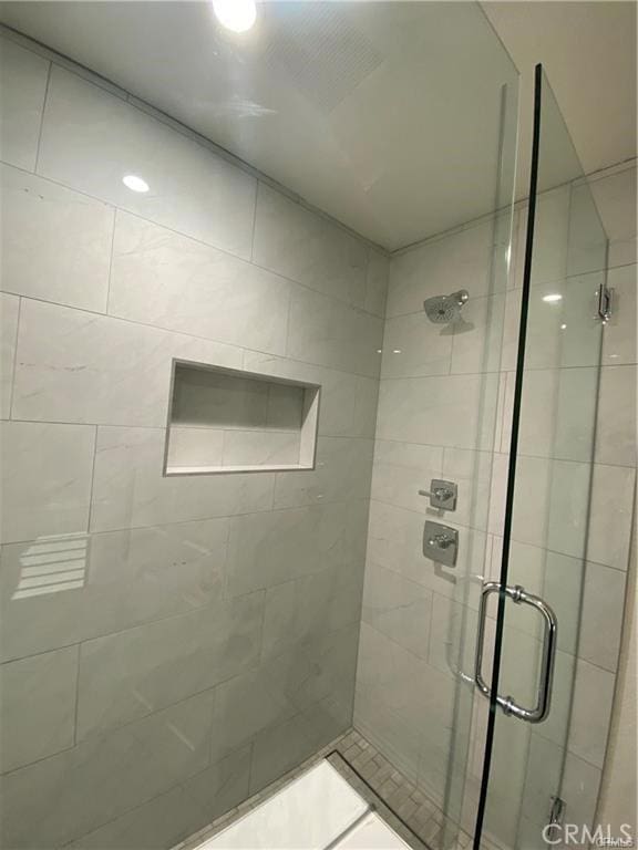 bathroom featuring a stall shower