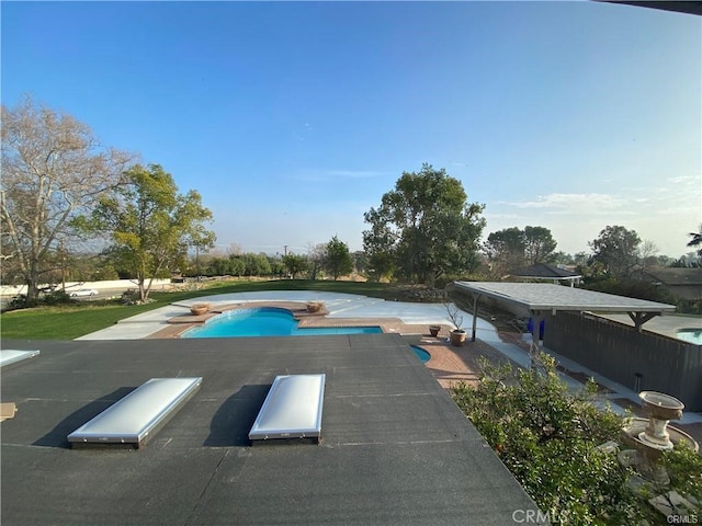 outdoor pool featuring a diving board