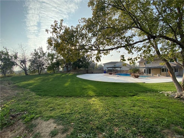 view of yard with a patio area and an outdoor pool