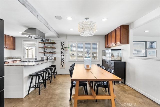 dining space featuring a chandelier, finished concrete floors, recessed lighting, and baseboards