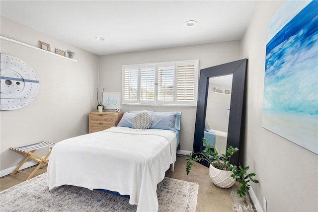 bedroom featuring baseboards