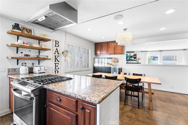 kitchen with finished concrete flooring, gas stove, baseboards, recessed lighting, and wall chimney exhaust hood