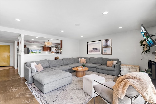 living area with recessed lighting and finished concrete floors