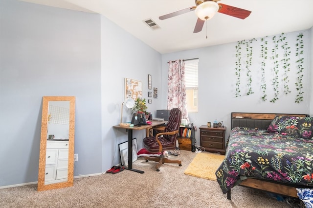 carpeted bedroom with baseboards, visible vents, and a ceiling fan