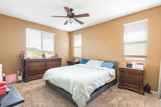 carpeted bedroom featuring a ceiling fan