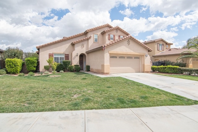 mediterranean / spanish home with a garage, a tile roof, driveway, stucco siding, and a front yard