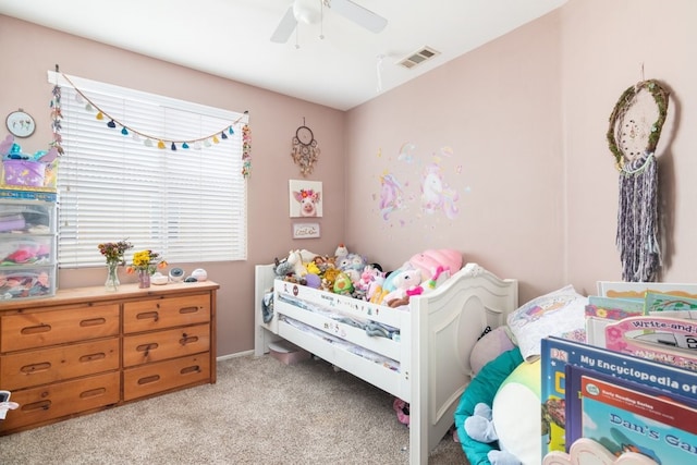 bedroom featuring light carpet, visible vents, and a ceiling fan