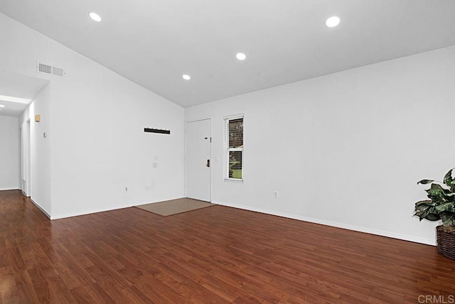 unfurnished room featuring lofted ceiling, wood finished floors, visible vents, and recessed lighting