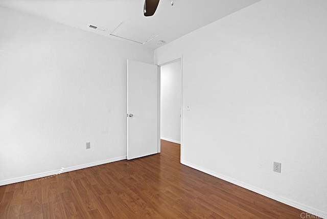 unfurnished room with a ceiling fan, baseboards, visible vents, and wood finished floors