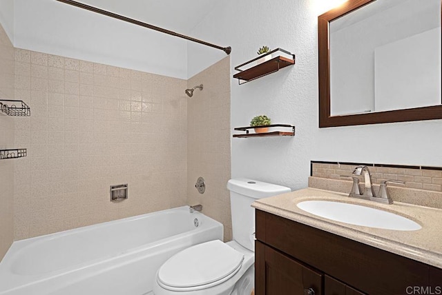 bathroom with shower / bathing tub combination, vanity, toilet, and tasteful backsplash