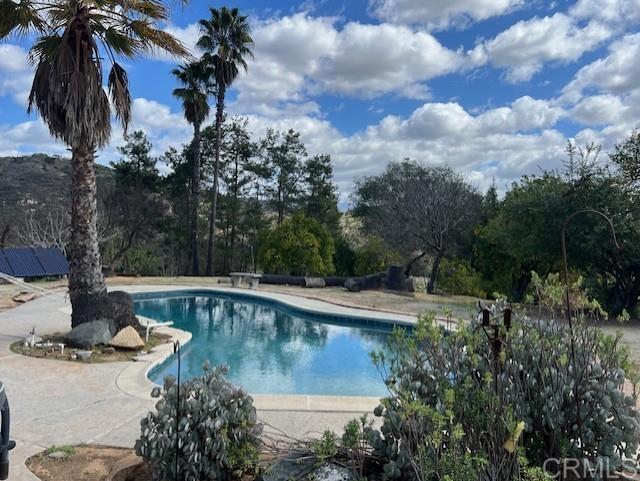 pool featuring a patio area