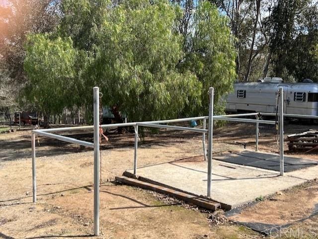 9946 Nutby Ln, Escondido, CA 92026 - surrounding community with fence and view of wooded area