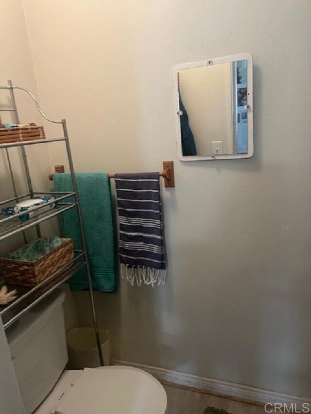 9946 Nutby Ln, Escondido, CA 92026 - bathroom featuring toilet, wood finished floors, and baseboards