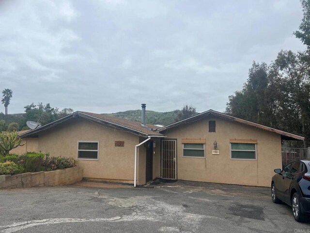 9946 Nutby Ln, Escondido, CA 92026 - view of front of property with stucco siding
