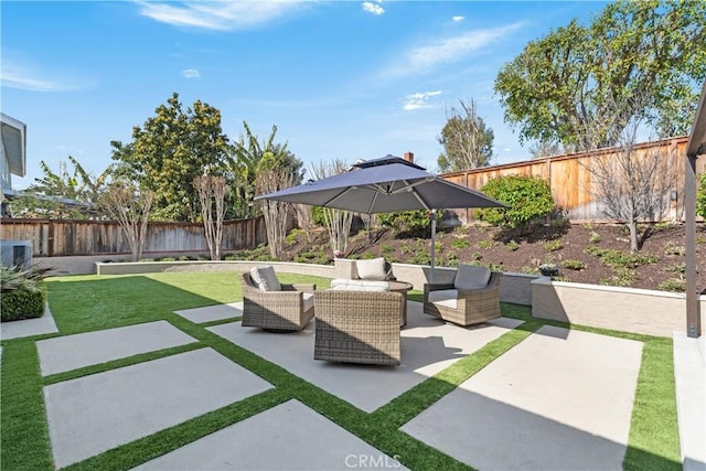 exterior space with outdoor lounge area, a patio, and a fenced backyard