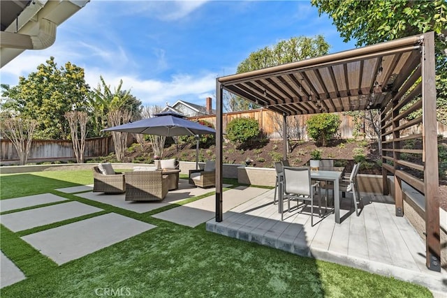 view of patio / terrace with outdoor lounge area, outdoor dining area, and a fenced backyard