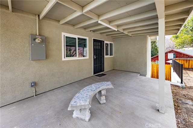 view of patio featuring fence