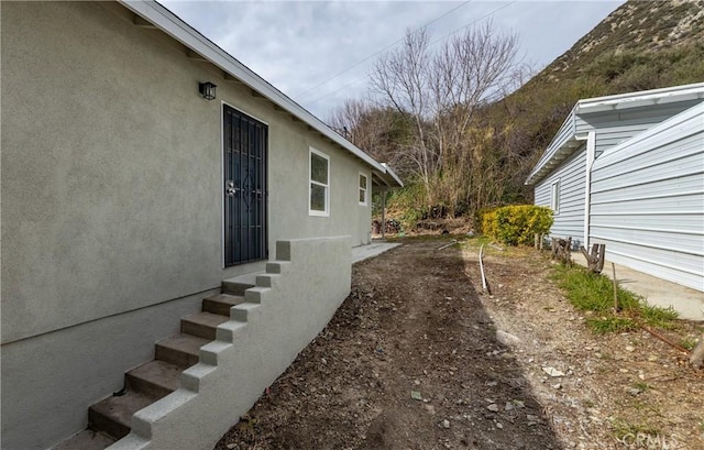 view of yard featuring entry steps