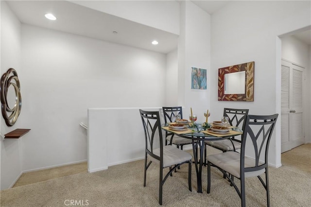 dining area featuring recessed lighting, carpet, and baseboards