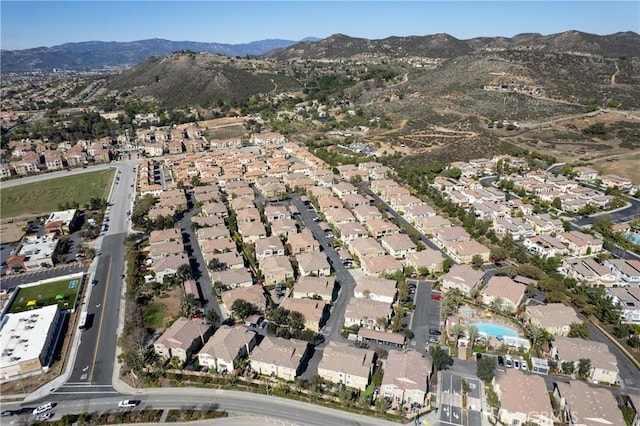 birds eye view of property featuring a mountain view and a residential view