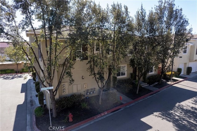 exterior space featuring stucco siding