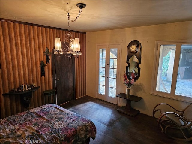 bedroom with dark wood-type flooring and french doors