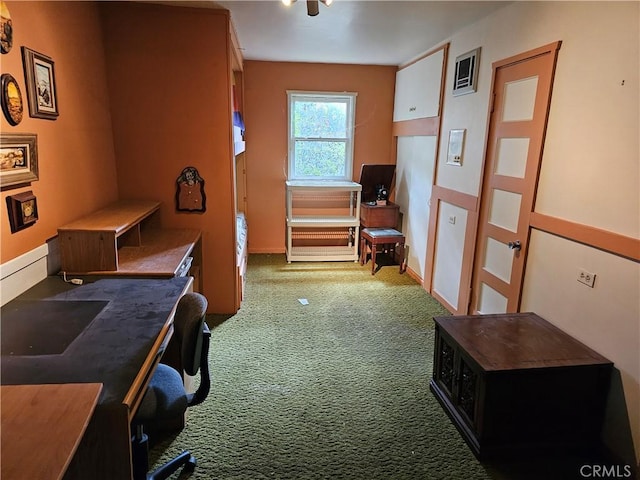 office area featuring carpet flooring, visible vents, and baseboards