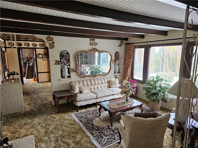 living room with carpet flooring and beam ceiling