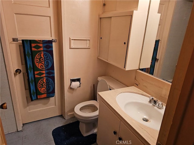 bathroom featuring toilet and vanity