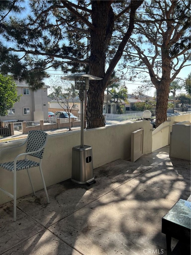 view of patio featuring fence