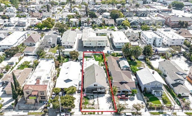 birds eye view of property with a residential view