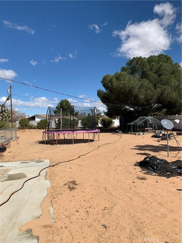 view of property's community featuring a trampoline