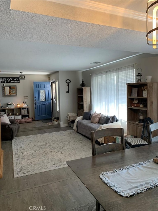 living area featuring a textured ceiling