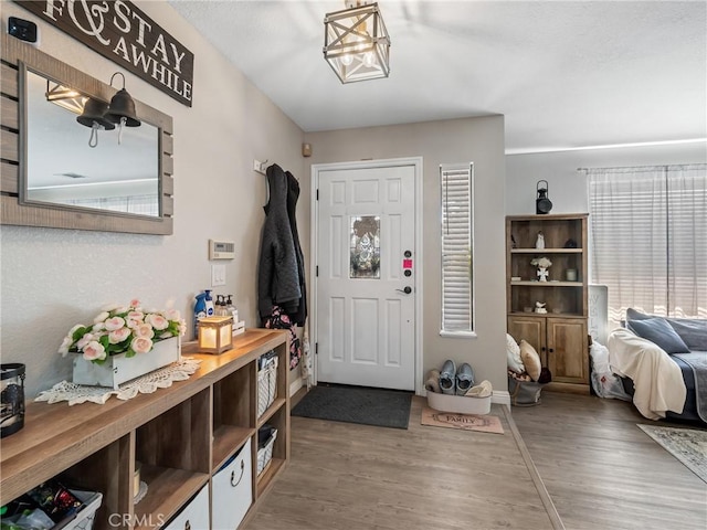 20312 Eyota Rd, Apple Valley, CA 92308 - foyer entrance with a wealth of natural light, baseboards, and wood finished floors
