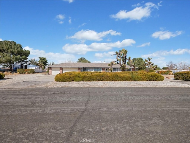 20312 Eyota Rd, Apple Valley, CA 92308 - view of front of home featuring concrete driveway and a garage