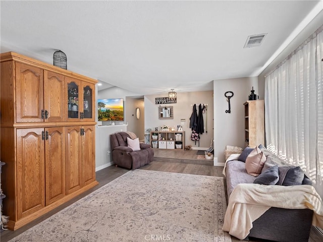 20312 Eyota Rd, Apple Valley, CA 92308 - living area with wood finished floors, visible vents, and baseboards