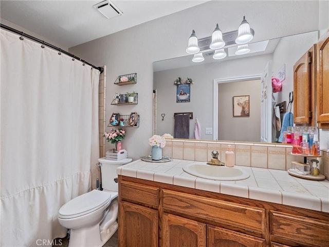 20312 Eyota Rd, Apple Valley, CA 92308 - full bath featuring visible vents, toilet, decorative backsplash, and vanity