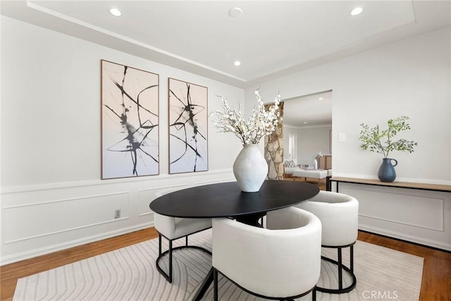 dining space featuring recessed lighting and wood finished floors