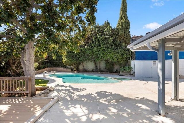 view of swimming pool with a patio area, a fenced in pool, and a fenced backyard