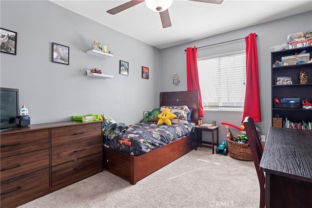 carpeted bedroom featuring a ceiling fan