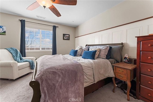 bedroom featuring ceiling fan, visible vents, and carpet flooring