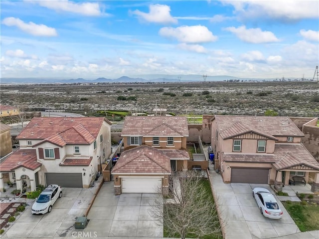 drone / aerial view with a residential view and a mountain view