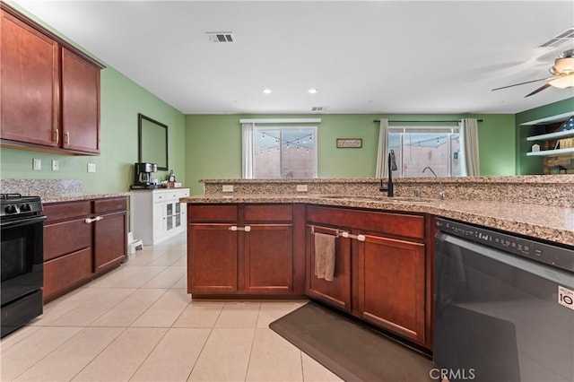 kitchen featuring a sink, black gas stove, visible vents, and stainless steel dishwasher