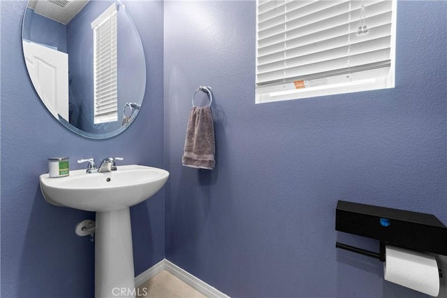 bathroom featuring baseboards