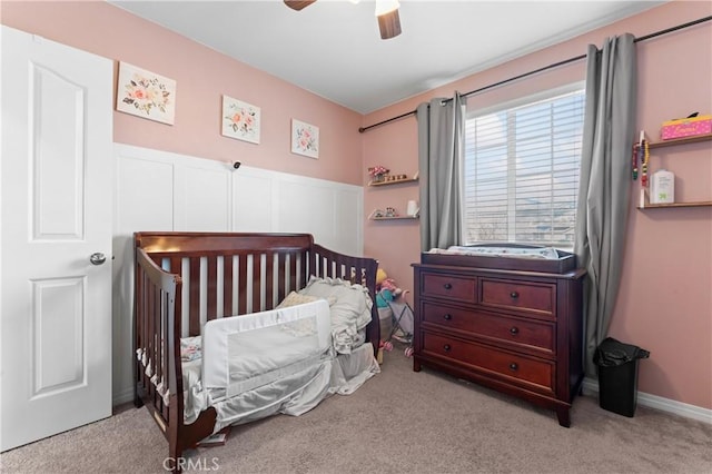 bedroom with carpet floors, a ceiling fan, and baseboards