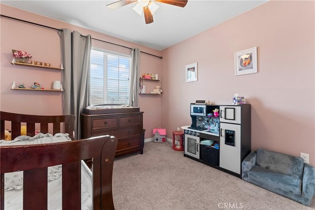 bedroom featuring carpet, baseboards, and a ceiling fan