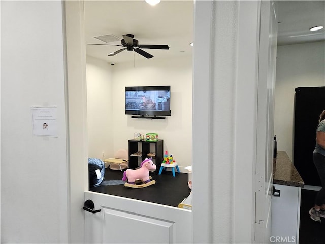 detailed view of a ceiling fan and recessed lighting