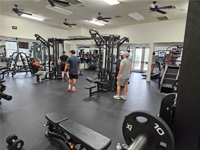 gym featuring a ceiling fan and french doors