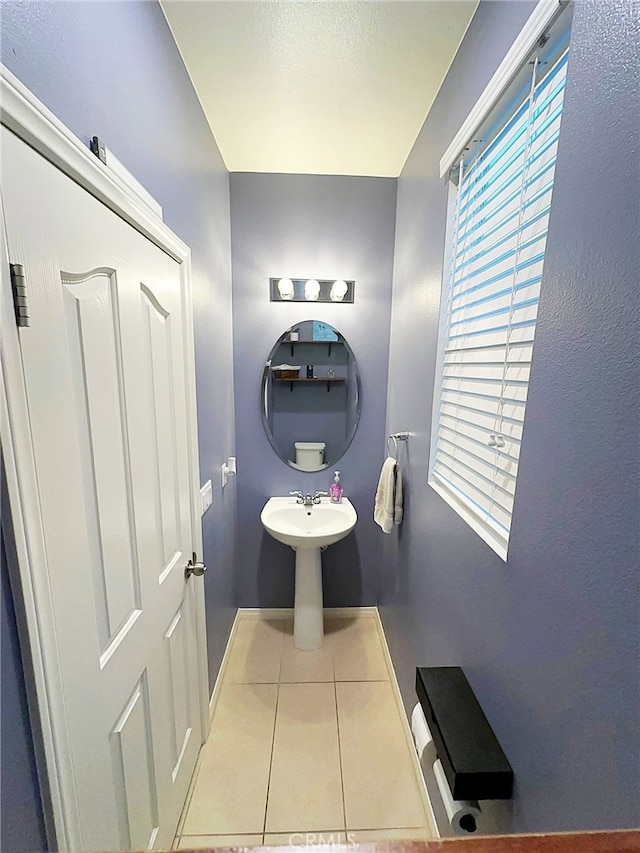 bathroom featuring tile patterned floors and baseboards