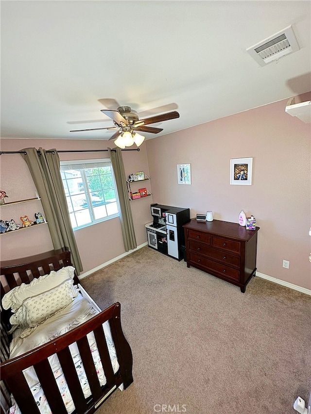 carpeted bedroom with baseboards and a ceiling fan